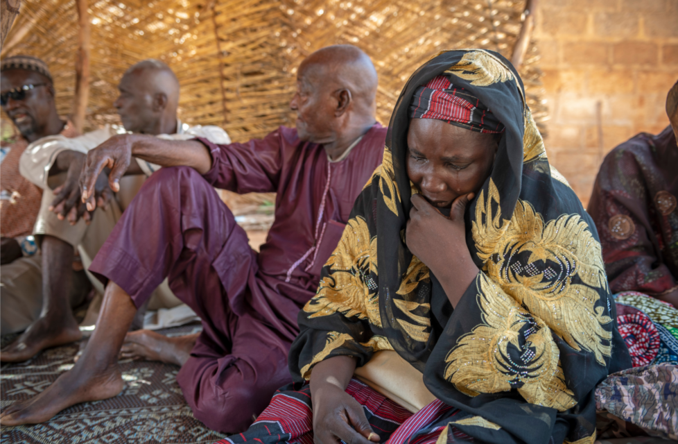 group of individuals in African country talking and thinking